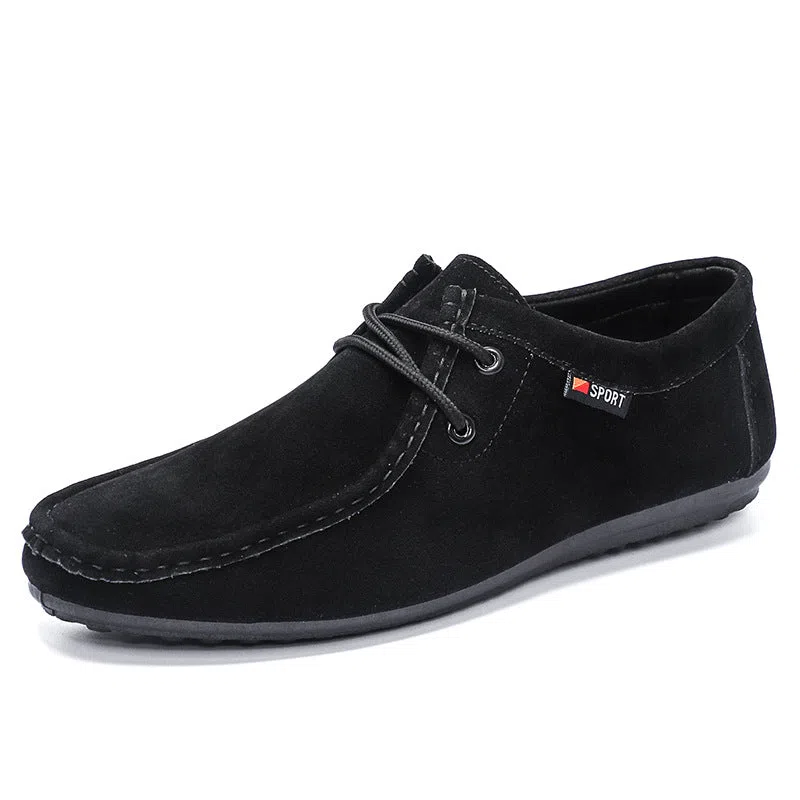 Men's black slip-on loafers with soft sole, round toe, and stitching detail on a neutral background