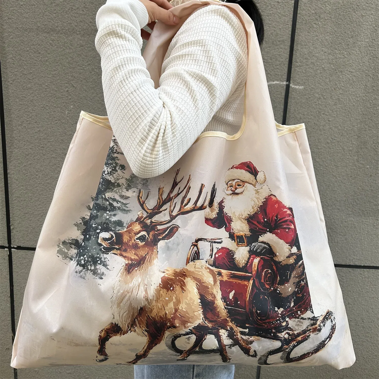 Large one-shoulder polyester Santa Claus gift bag with festive red and white design