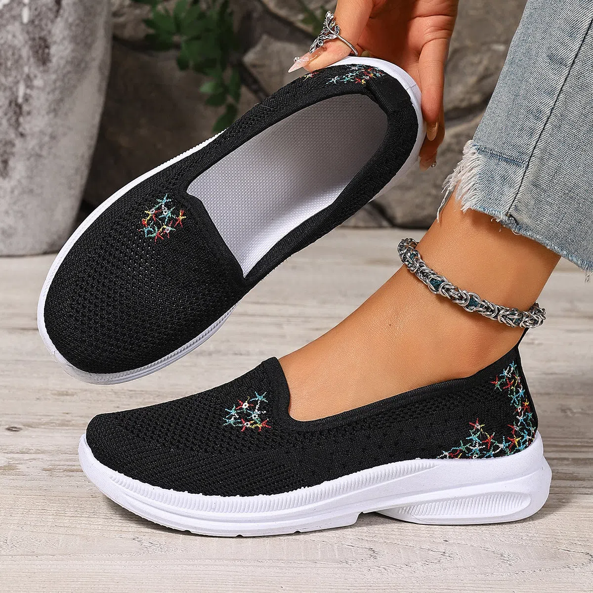 Women's mesh casual slip-on shoes in beige with round toe and low-cut shaft on a plain background