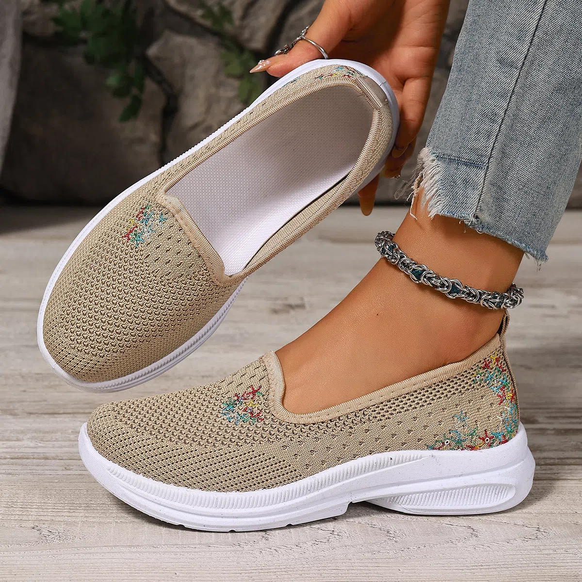 Women's mesh casual slip-on shoes in beige with round toe and low-cut shaft on a plain background