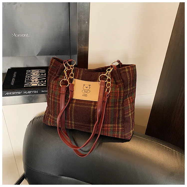Wool plaid women's single-shoulder commuter bag in brown with stitched seam detailing and double straps