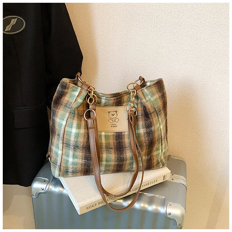 Wool plaid women's single-shoulder commuter bag in brown with stitched seam detailing and double straps