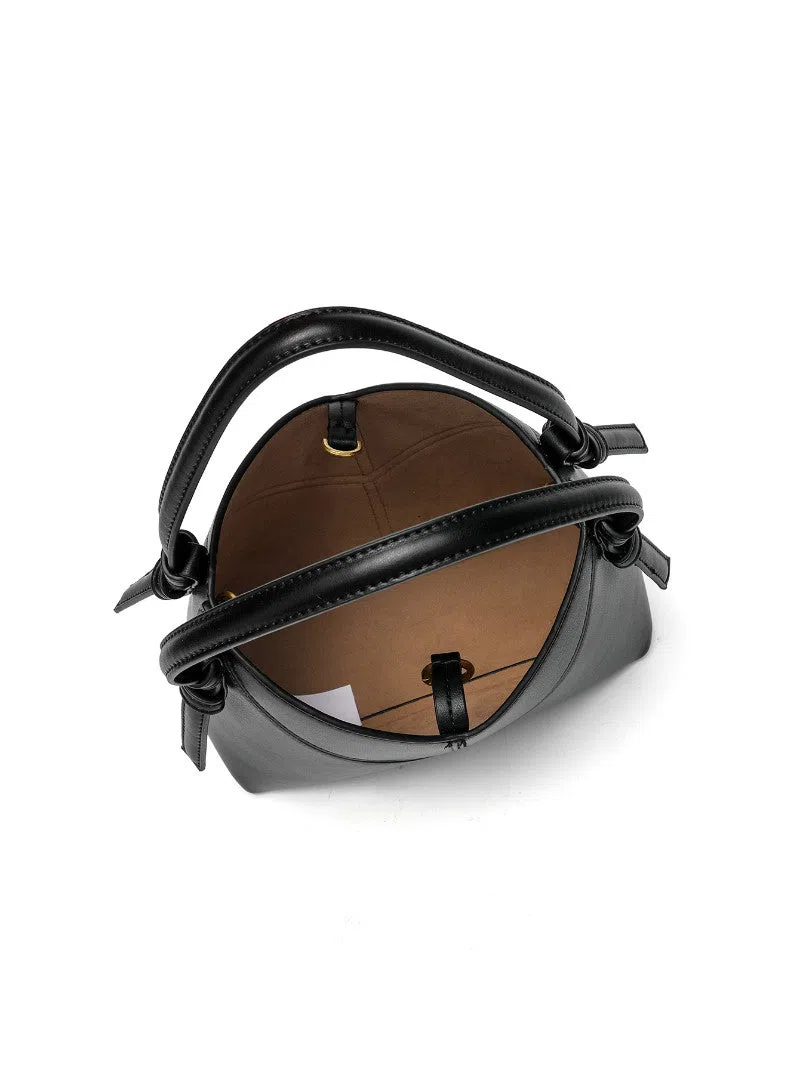 Trendy solid colour stitched oval handbag and crossbody bag for women in black with single shoulder strap and interior slip pocket
