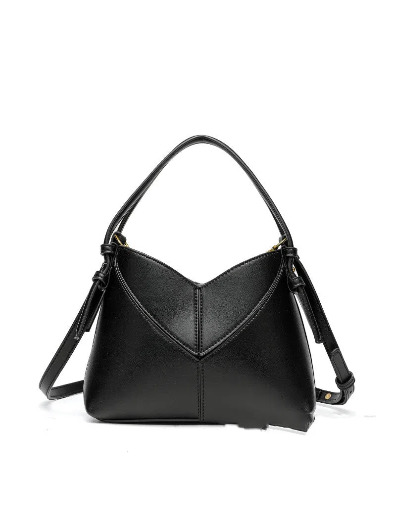 Trendy solid colour stitched oval handbag and crossbody bag for women in black with single shoulder strap and interior slip pocket