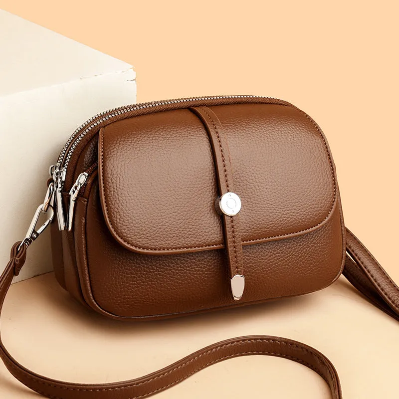 Soft PU women's crossbody shoulder bag in oval suitcase shape with sewing thread detail