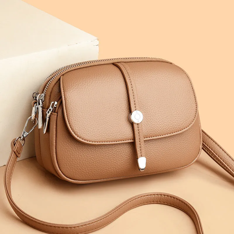 Soft PU women's crossbody shoulder bag in oval suitcase shape with sewing thread detail