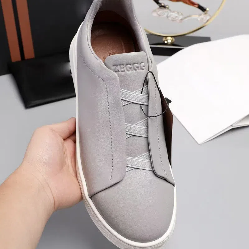 Men's genuine leather cross-strap casual shoes with cowhide upper, round toe, flat heel, and front laces