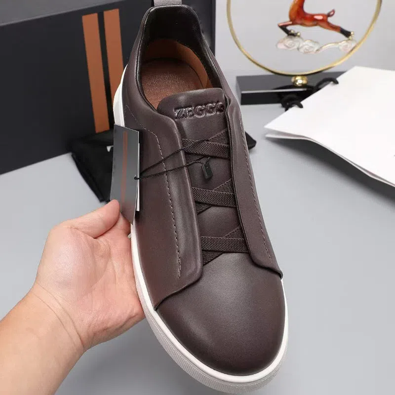 Men's genuine leather cross-strap casual shoes with cowhide upper, round toe, flat heel, and front laces