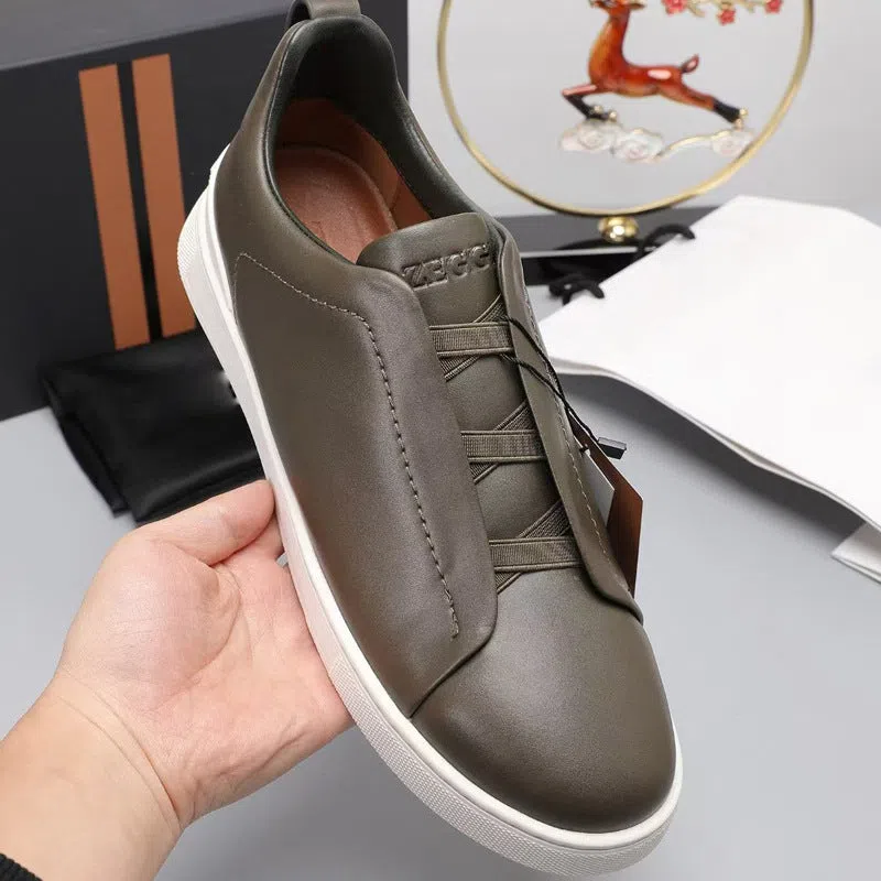 Men's genuine leather cross-strap casual shoes with cowhide upper, round toe, flat heel, and front laces