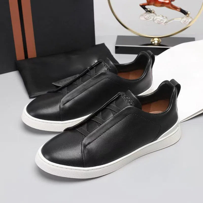 Men's genuine leather cross-strap casual shoes with cowhide upper, round toe, flat heel, and front laces
