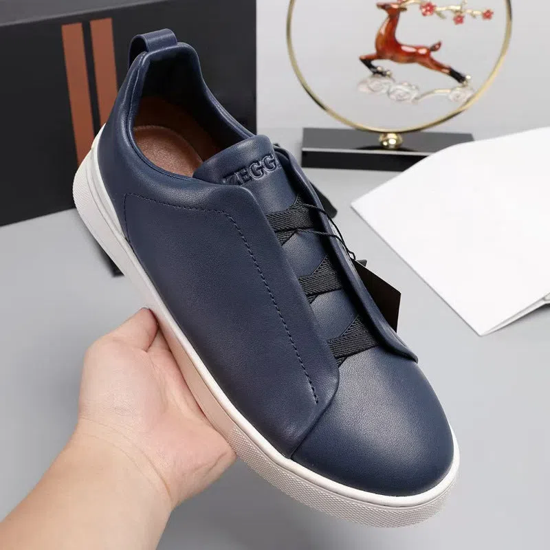 Men's genuine leather cross-strap casual shoes with cowhide upper, round toe, flat heel, and front laces