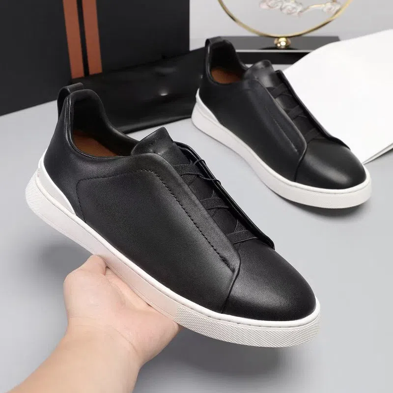 Men's genuine leather cross-strap casual shoes with cowhide upper, round toe, flat heel, and front laces