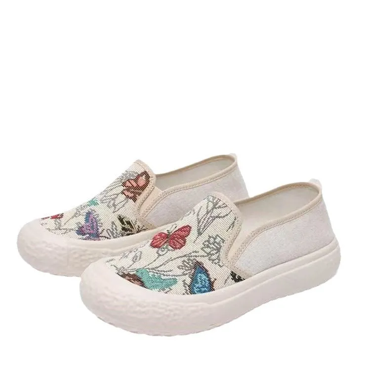 Women's slip-on canvas shoes in Black with round toe and decorative sewing thread details