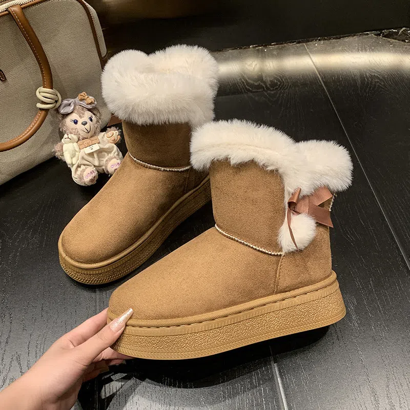 Women's mid-calf fleece-lined snow boots in brown with black rubber sole and bow tie detail