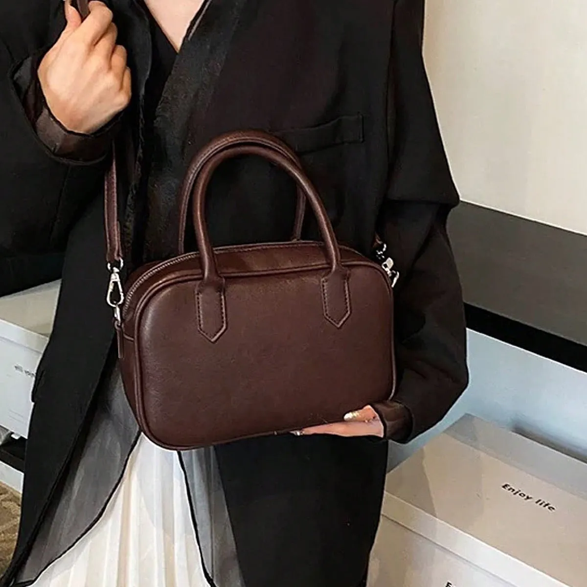 Retro square shoulder messenger bag in black PU leather with a single strap.