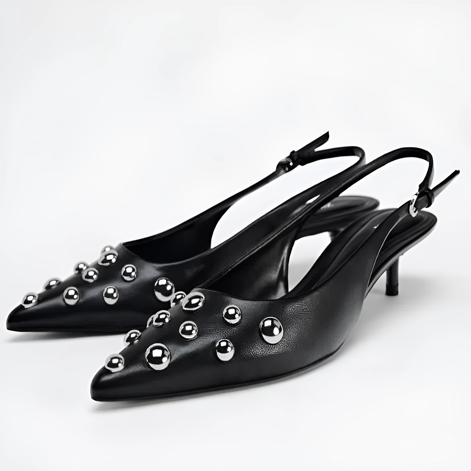 Women's black low-cut pointed-toe wedge stiletto heels with rivet decoration and slip-on design