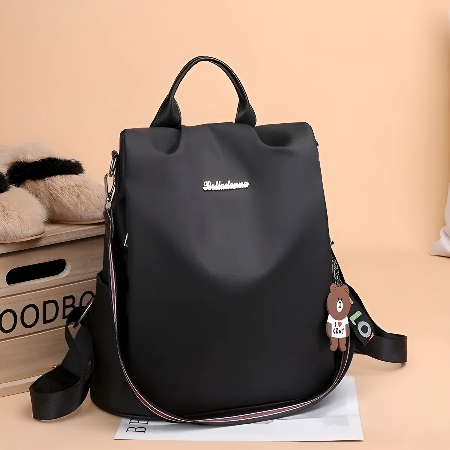 Women's large capacity black backpack with Oxford fabric lining, laptop sleeve, and trendy stitched seams and colour blocking