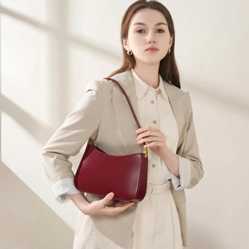 Women's casual French-style oval one-shoulder bag in cowhide leather, 25.5x6x14cm, available in black