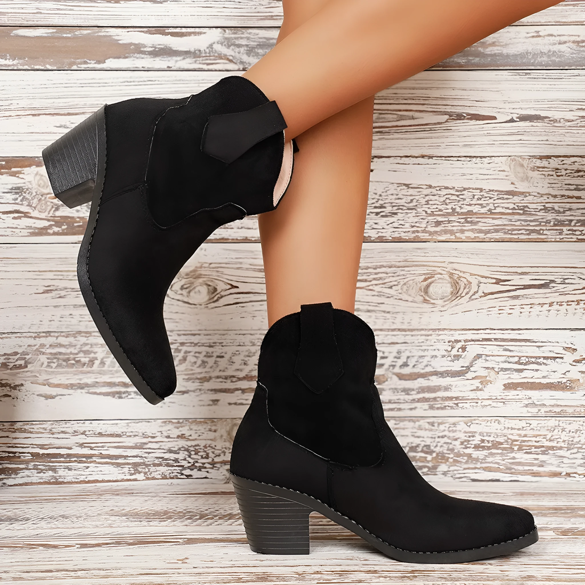 Women's suede ankle boots with a chunky heel and pointed toe in black