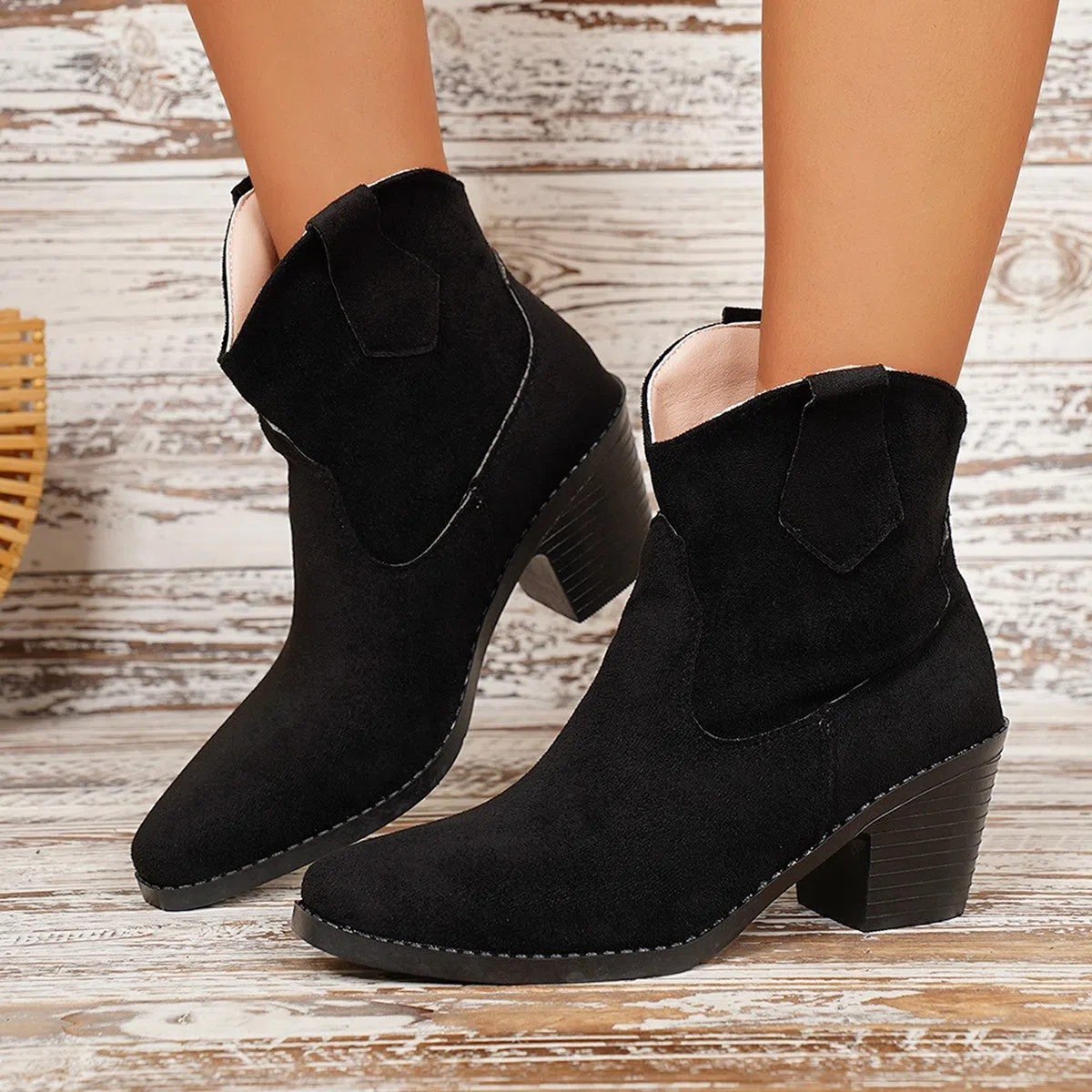 Women's suede ankle boots with a chunky heel and pointed toe in black