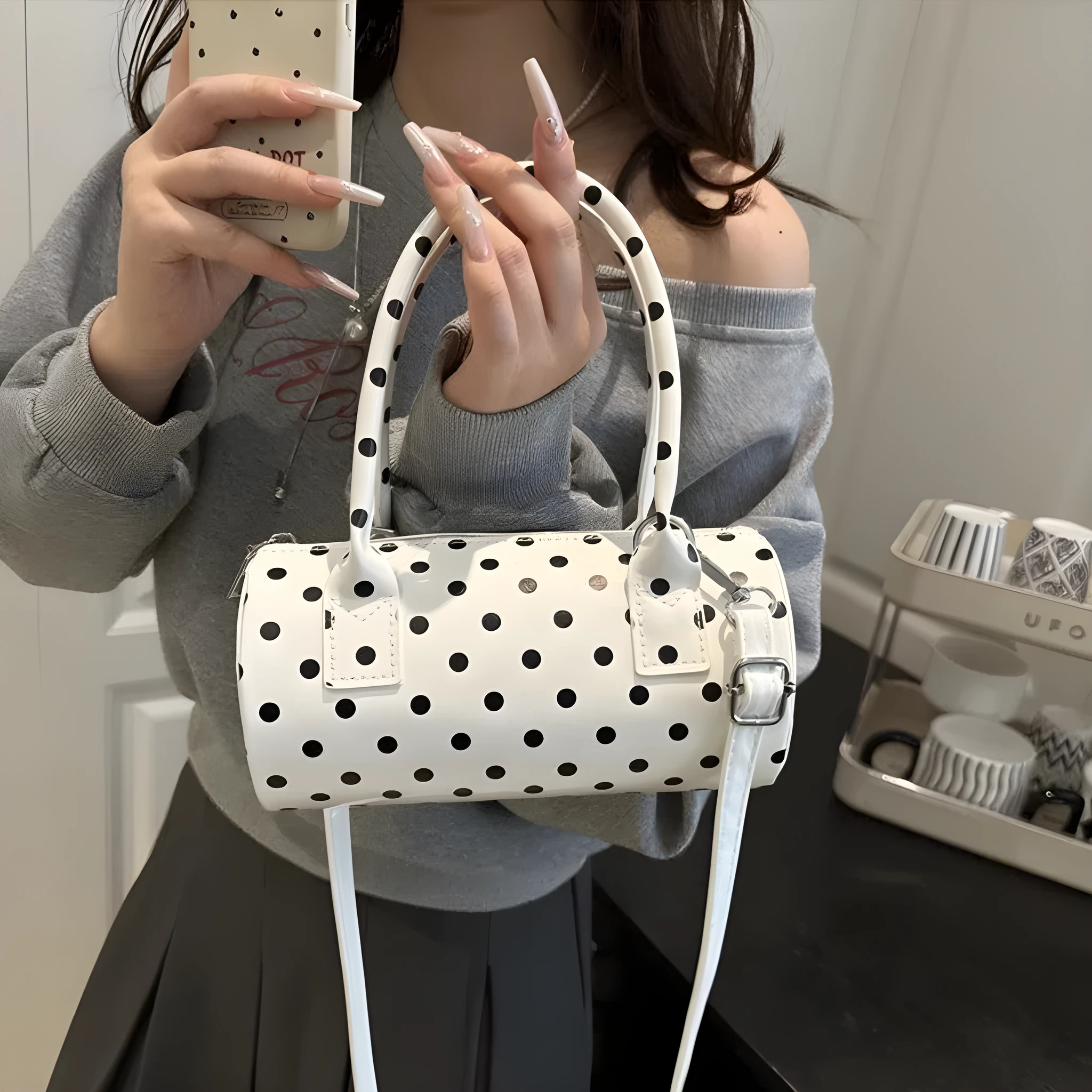 Korean-style cylindrical tote pillow bag in PU leather with stitched seams, black colour, single strap