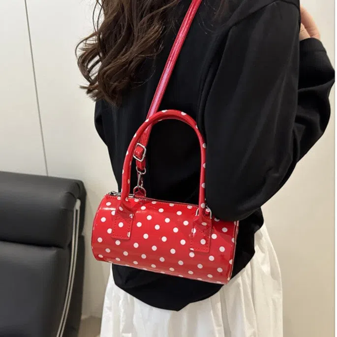 Korean-style cylindrical tote pillow bag in PU leather with stitched seams, black colour, single strap