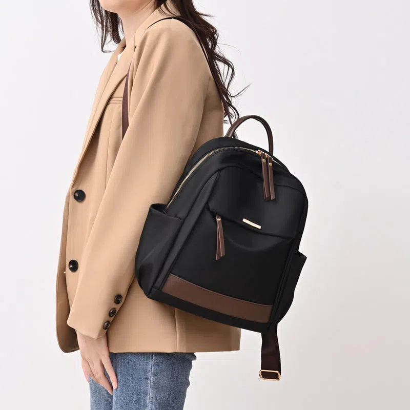 Women's lightweight nylon travel backpack in milk tea colour with large-capacity main compartment