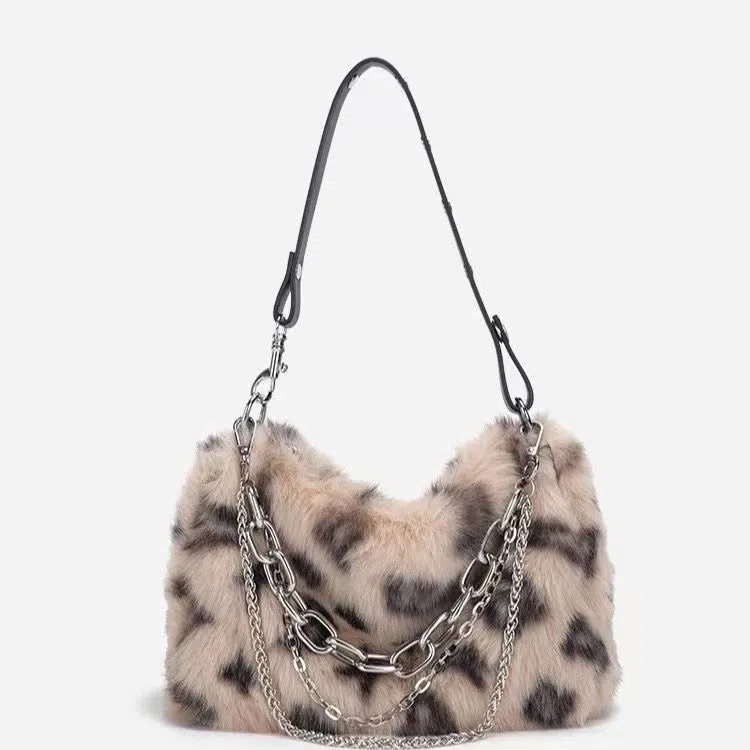Plush luxury-style chain bag in apricot with leopard print and gold-tone chain, horizontal rectangular shape, soft texture.
