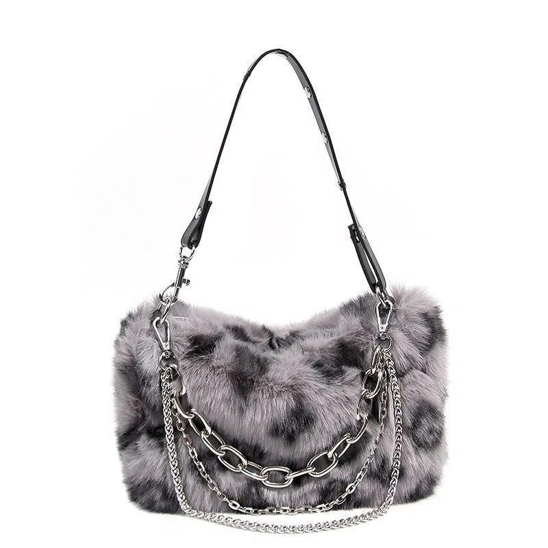 Plush luxury-style chain bag in apricot with leopard print and gold-tone chain, horizontal rectangular shape, soft texture.
