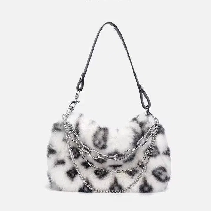 Plush luxury-style chain bag in apricot with leopard print and gold-tone chain, horizontal rectangular shape, soft texture.