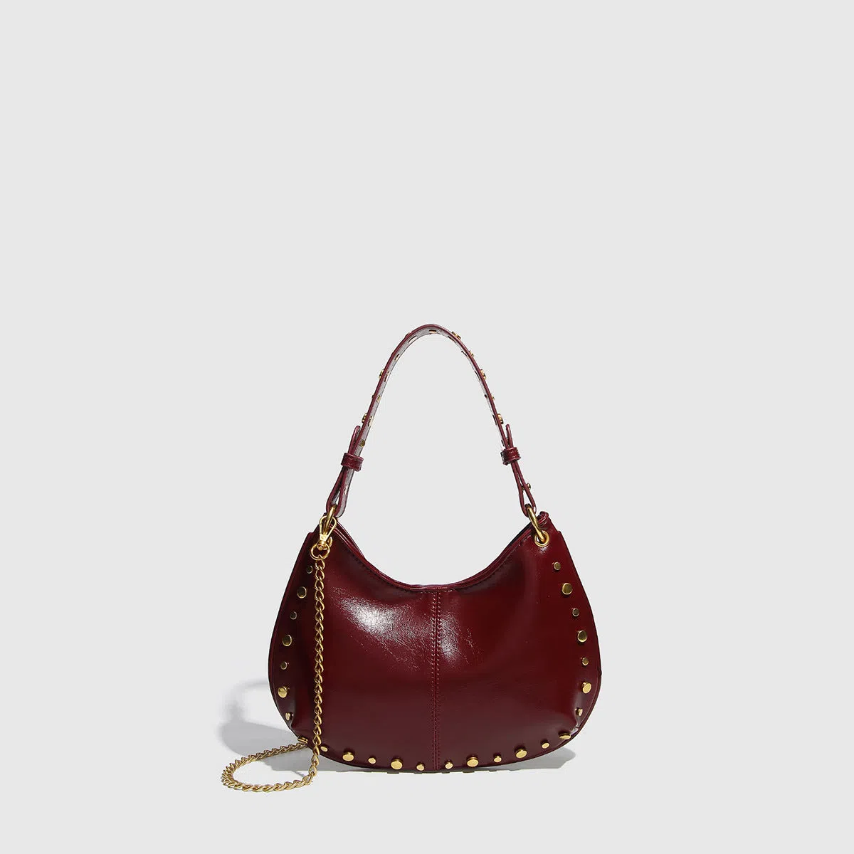 Woman's PU leather dumpling-shaped underarm bag with rivet studs and double straps, in black