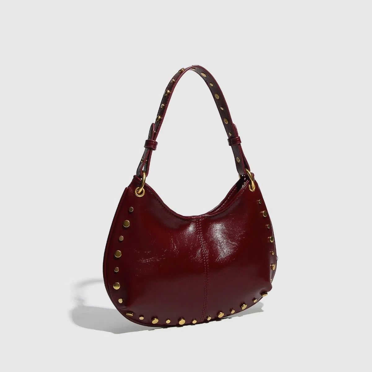 Woman's PU leather dumpling-shaped underarm bag with rivet studs and double straps, in black