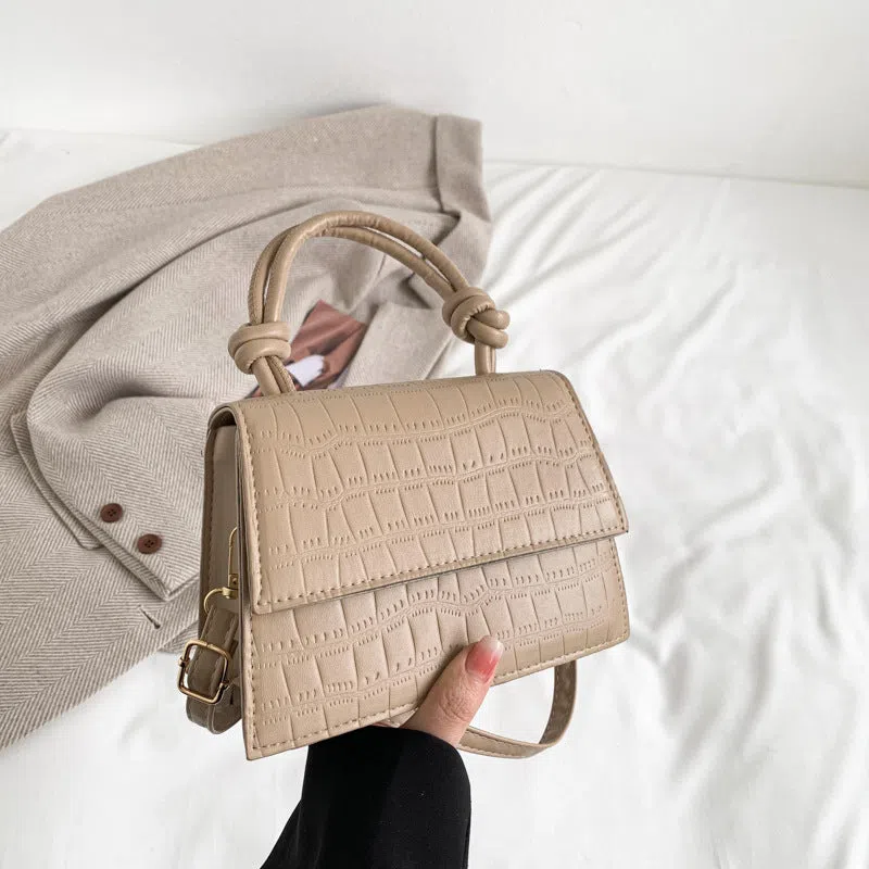 Women's soft PU underarm bag in horizontal rectangle shape with stitched seams and single shoulder strap