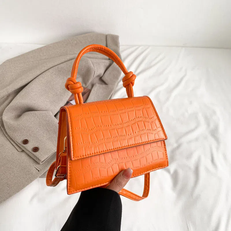 Women's soft PU underarm bag in horizontal rectangle shape with stitched seams and single shoulder strap