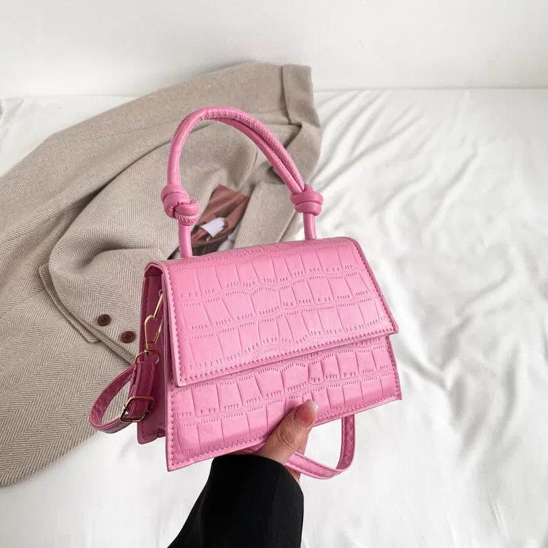 Women's soft PU underarm bag in horizontal rectangle shape with stitched seams and single shoulder strap