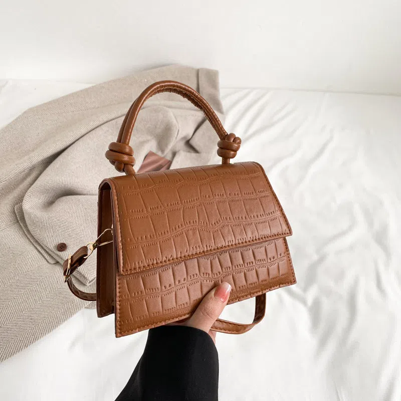 Women's soft PU underarm bag in horizontal rectangle shape with stitched seams and single shoulder strap
