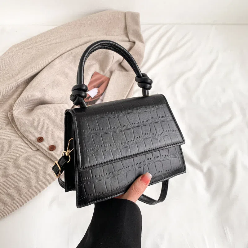 Women's soft PU underarm bag in horizontal rectangle shape with stitched seams and single shoulder strap