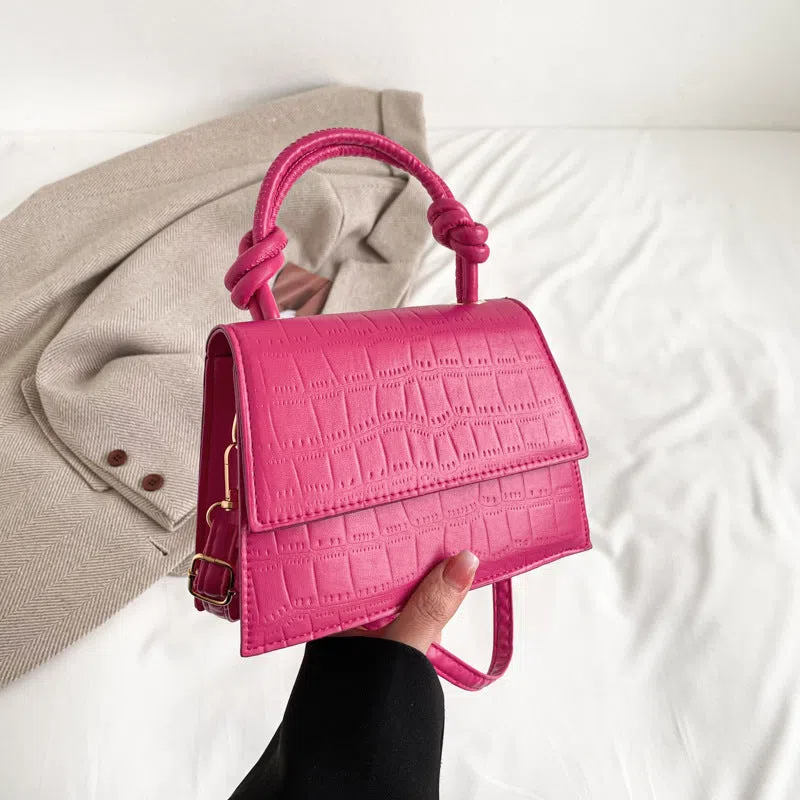 Women's soft PU underarm bag in horizontal rectangle shape with stitched seams and single shoulder strap