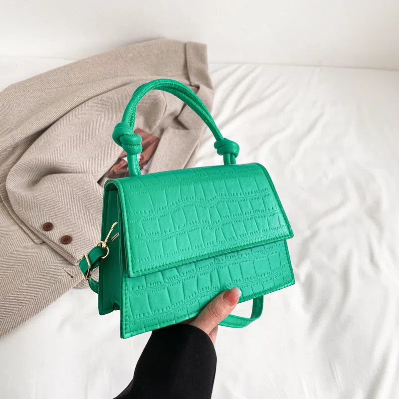 Women's soft PU underarm bag in horizontal rectangle shape with stitched seams and single shoulder strap