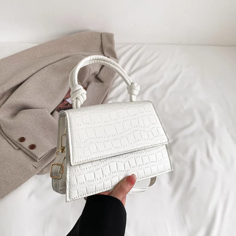 Women's soft PU underarm bag in horizontal rectangle shape with stitched seams and single shoulder strap