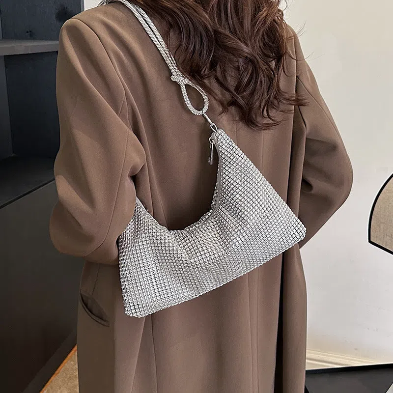 Women's solid-colour nylon shoulder bag with faux rhinestone details, chain strap, and zipper closure in silver