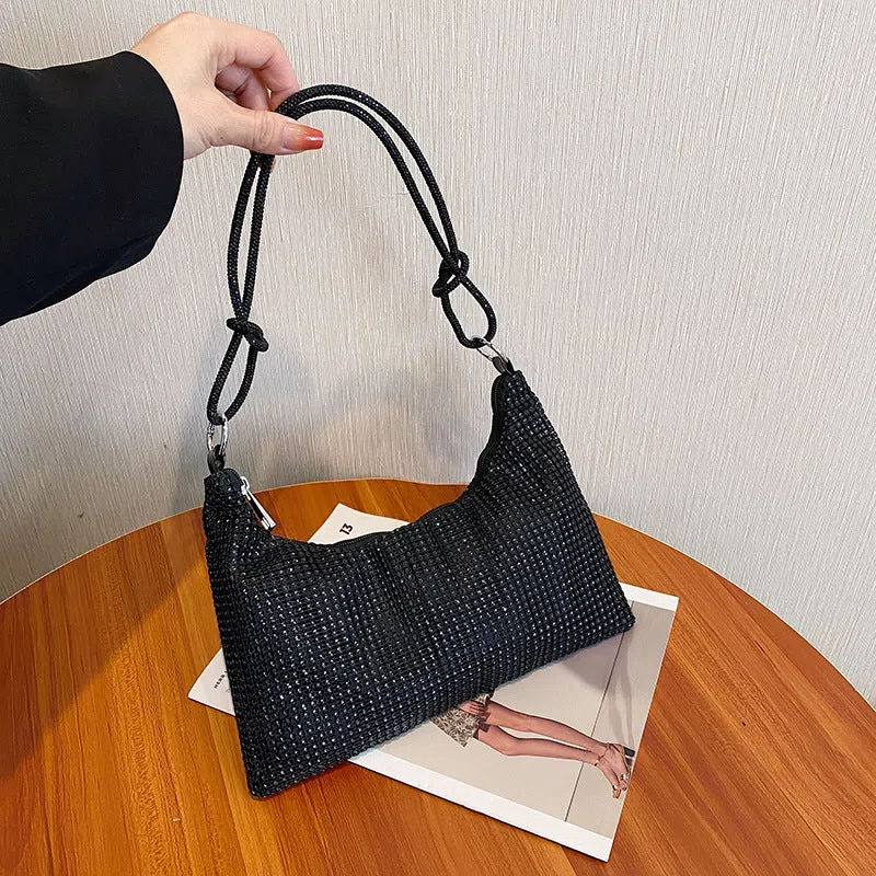 Women's solid-colour nylon shoulder bag with faux rhinestone details, chain strap, and zipper closure in silver