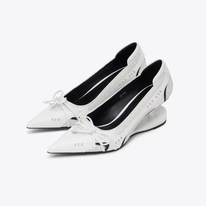 Women's black pointed toe Mary Jane shoes with a distinctive shaped floating heel and slip-on design.