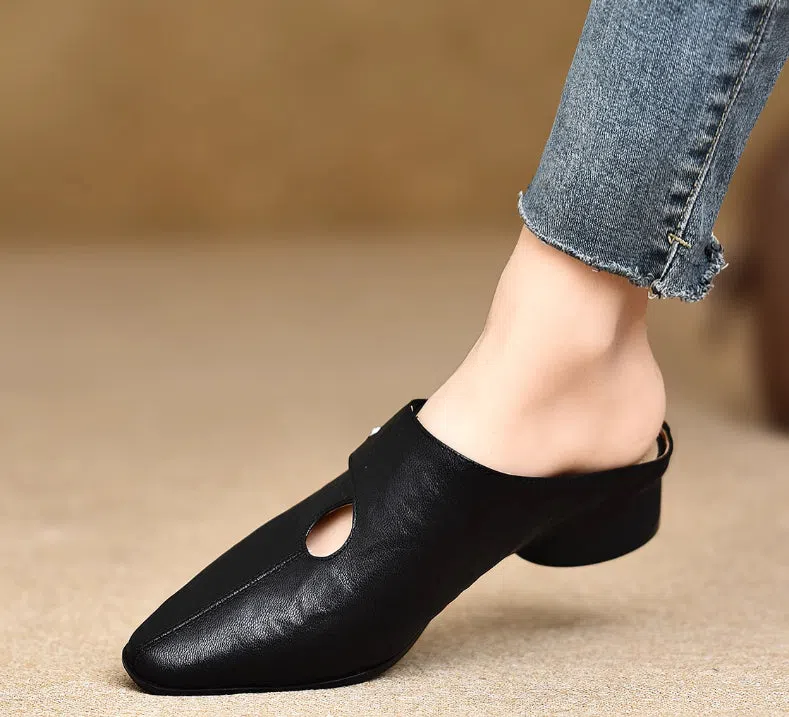 Women's slip-on slippers in first-layer sheepskin with hand-stitched pattern and hollow-out design, beige colour, low heel.