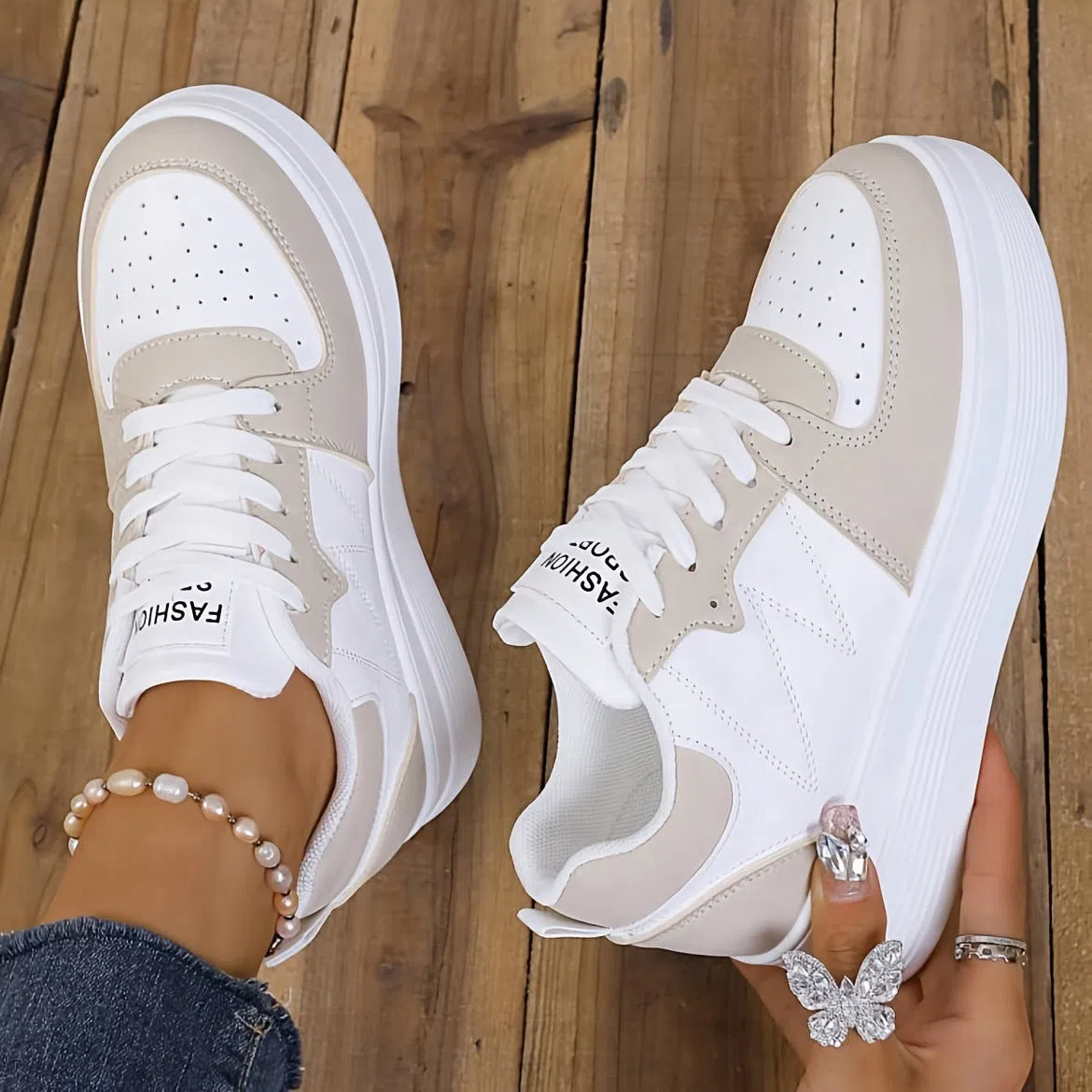 Children's low-top lace-up sneakers in white with canvas upper and thick sole, side view