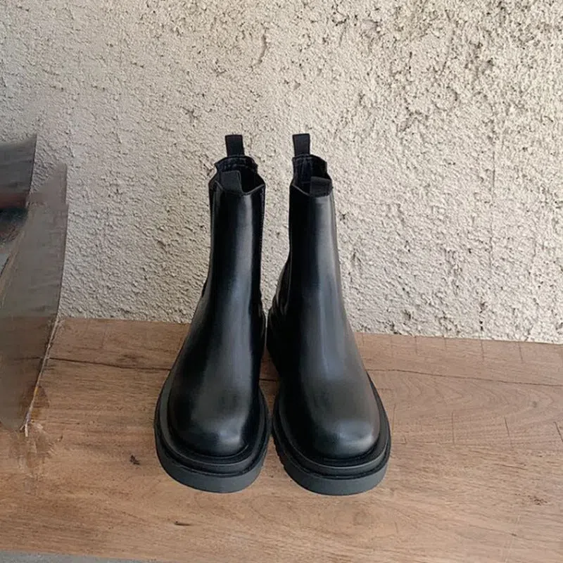 Women's black mid-calf boots with chunky low heel, round toe, and wear-resistant rubber sole in British style