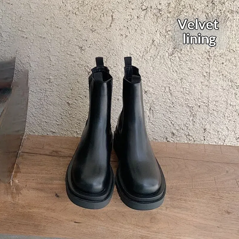 Women's black mid-calf boots with chunky low heel, round toe, and wear-resistant rubber sole in British style