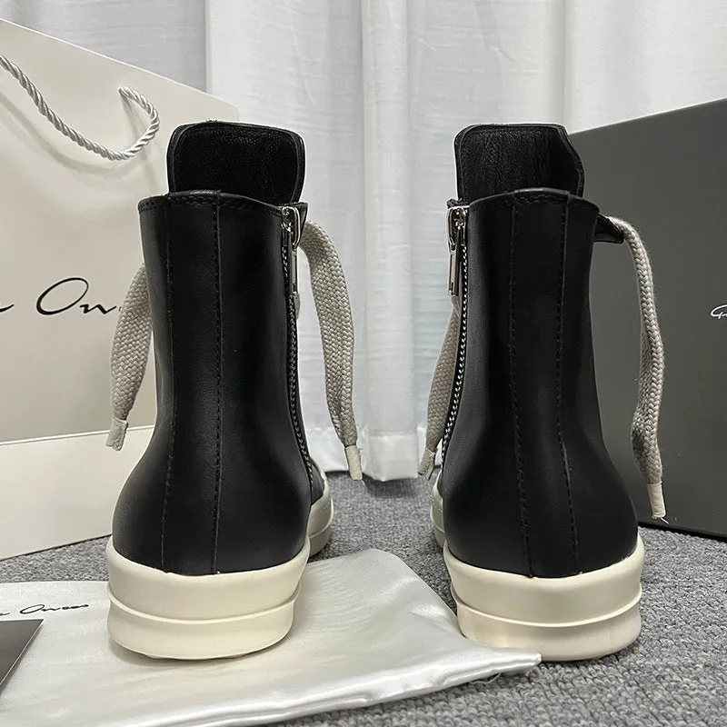 Black leather high-top sneakers with side zipper and round toe on a rubber platform sole