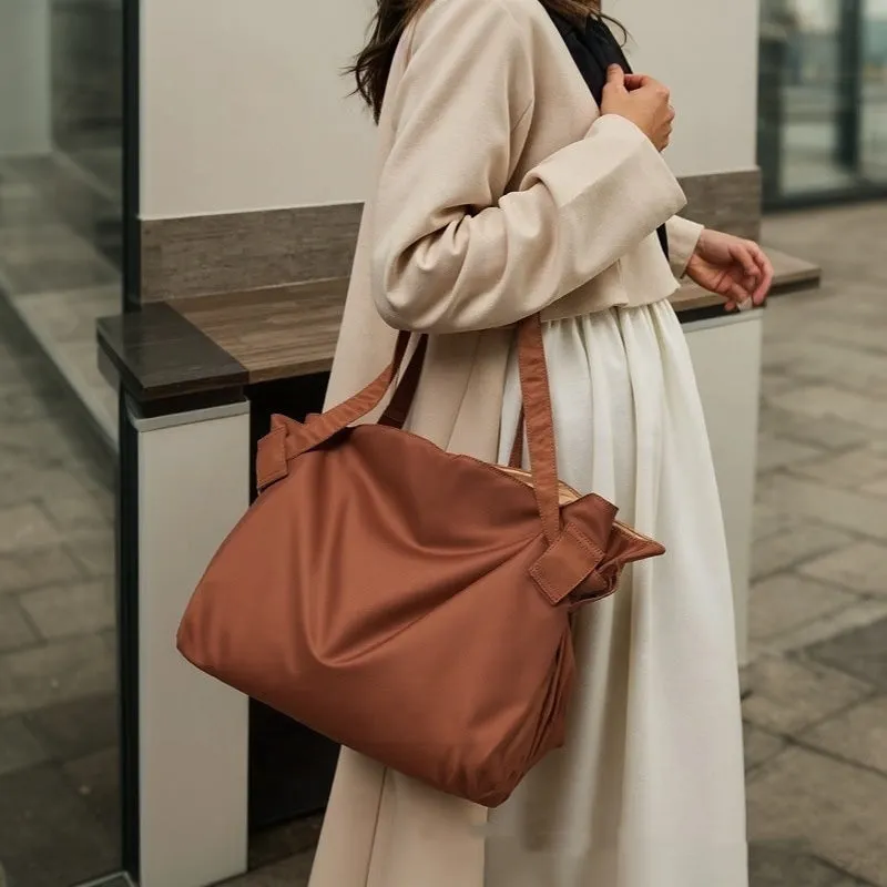 Women's Oxford cloth expandable shoulder crossbody bag in black or light brown for travel and daily storage