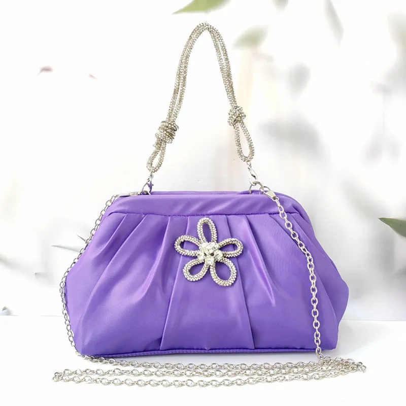 Soft black women's large-capacity dinner bag with chain strap and shell shape.